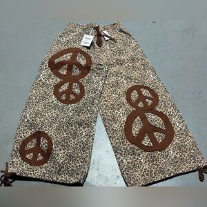 DAVI & DANI Leopard Print Wide Leg Pants with Brown Peace Symbols
